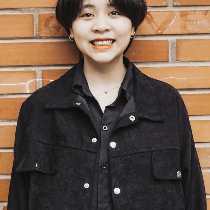 Kaveri Mehta, Lead Design Curator at HarvestIsleJuniper, reviewing corporate floral arrangements